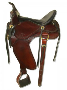 Mahogany Western Trail Saddle with butterfly skirts and Western rigging with a flank cinch, Frank Bell pommel with and a horn, extra padded seat with a Mexican braided cantle, wide fenders and border tooling.