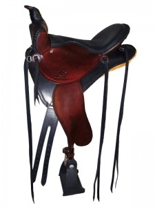 Black Mahogany Saddle with cutback skirts and bulkless English rigging, Frank Bell pommel and a horn with a roper's wrap, extra padded seat with a Mexican braided cantle, streamlined fenders and border tooling.