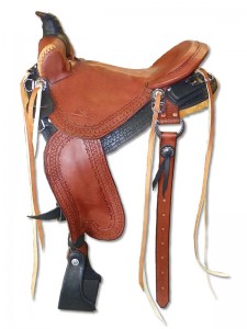 Black Chestnut Western Trail Saddle with cutback skirts, Frank Bell Pommel with a horn slick seat with a Cheyenne Roll wide fenders and border tooling